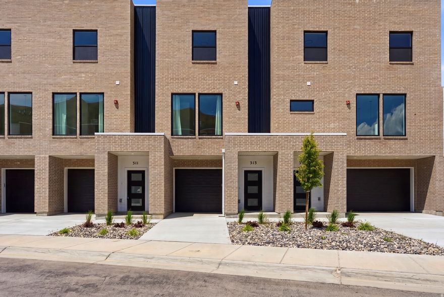 Last few new construction units remaining. Step into this thoughtfully designed 3-bedroom, 3.5-bath townhouse offering breathtaking views of the Salt Lake Valley and modern-day comfort throughout. Large windows invite abundant natural light into the home, enhancing the open and airy feel of each space. The kitchen connects effortlessly to the main living and dining areas, creating an ideal layout for both relaxed daily living and hosting gatherings. The property includes a one-car garage plus an additional driveway parking spot for added convenience. The spacious primary suite serves as a private retreat, featuring its own en-suite bath and generous closet space. Two additional bedrooms, each with access to full bathrooms, offer flexibility for guests, family members, or a dedicated home office. Located just moments from outdoor adventures, shopping centers, restaurants, and easy freeway access, this home delivers comfort, quality, and convenience in one of the valley's desirable areas. Enjoy stylish living with scenic surroundings in this exceptional Salt Lake Valley townhouse.