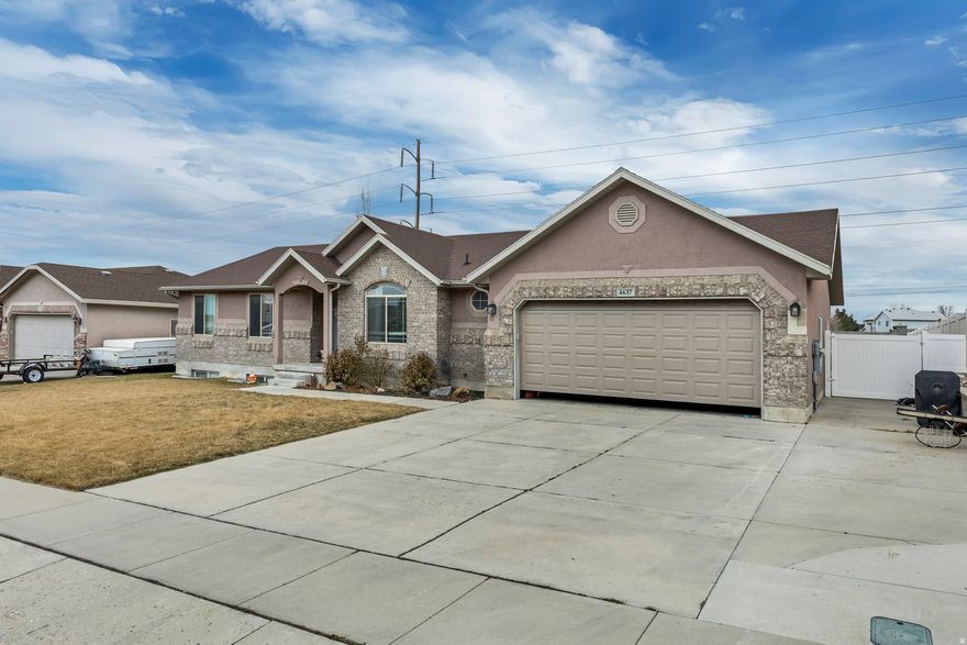 Beautiful 6-bedroom, 3-bath rambler built in 2004, located in a great West Jordan neighborhood! This spacious home sits on a large 0.24-acre lot and offers plenty of room both inside and out.  Step inside to tall ceilings that create an open, airy feel throughout the main living areas. The home features a formal dining room, perfect for hosting family dinners or special gatherings. The cozy fireplace adds warmth and charm to the living space, making it the perfect place to relax.  With six generously sized bedrooms, there is plenty of space for family, guests, or even a home office. The large family room is ideal for movie nights, watching TV, or game nights with friends and family.  Additional features include a 2-car garage, ample storage, and a layout designed for comfortable living. With its spacious interior, large yard, and welcoming neighborhood, this home is ready for new owners to move in and make it their own.