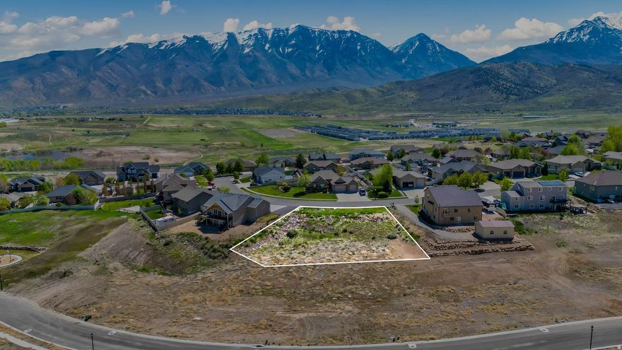 Nestled in the quiet, family-friendly Ridge subdivision of the Summit Ridge area in Santaquin, Utah, this beautiful 0.48-acre lot offers the perfect opportunity to build your dream home. With all utilities already stubbed and preliminary building plans approved with the HOA included in the sale, you can quickly start building. Enjoy peaceful living with stunning mountain views, easy freeway access, and close proximity to schools, parks, and shopping. Don't miss this rare chance to own a ready-to-build lot in one of Santaquin's most desirable communities!