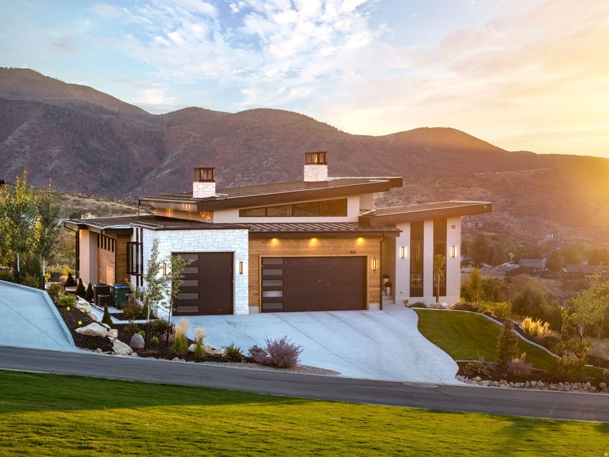 Perched in Summit Creek in Woodland Hills, this mountain-modern custom home blends refined architecture with a stunning alpine backdrop and sweeping mountain-and-valley views. Set on a .34-acre lot with a 3-car garage, the 6-bed, 6-bath, 5,153 sq ft layout is designed to live and entertain beautifully, with open, welcoming spaces on both levels. Floor-to-ceiling windows frame the panorama, while hidden retractable screens invite fresh mountain air. Custom exterior Polar Shades provide premier solar protection, glare reduction, and energy efficiency-without sacrificing the view. The outdoor living space flows seamlessly to a gas fire pit, perfect for sunset watching and summer fireworks over the valley. The lower level offers a flexible suite currently used as a home gym, but it can easily convert to a spacious bunk room with space for four bunks-ideal for hosting a crowd. Summit Creek is known for its high-end custom homes and resort-style amenities, including an elegant clubhouse ideal for events (even mountain weddings), a well-equipped fitness room, multiple pools, and hot tubs open for both Thanksgiving and Christmas. Miles of nearby trails offer endless hiking, biking, and ATV adventures-where luxury mountain living becomes an everyday experience.
