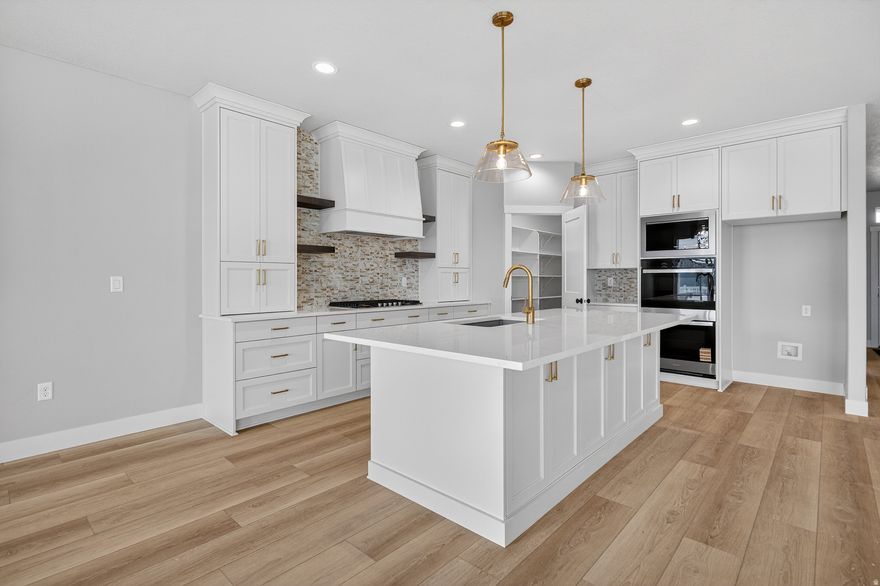 Great Views!!!  Charming partial-daylight rambler on a quiet country road with beautiful mountain views and partial fencing. This home features a spacious kitchen with a large island and generous pantry, opening to a bright, airy great room with access to the deck. With 5 bedrooms, 3 baths, and a walk-out basement, there's room for everyone. Lower level includes 9' ceilings, a theater room and plenty of space to relax or entertain. A peaceful rural setting with modern comforts-ready to enjoy.