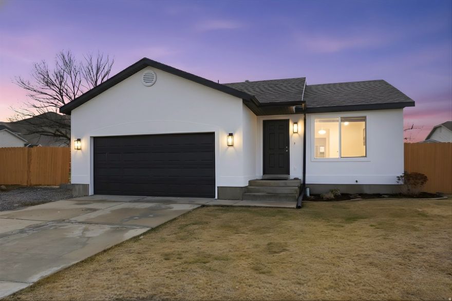This beautifully remodeled 4 bedroom, 2 bathroom rambler in Tooele offers modern finishes and true move in ready living. The interior has been thoughtfully updated with fresh paint and new flooring throughout, new countertops, new appliances, updated hardware, and stylish light fixtures that give the home a clean, contemporary feel. The layout is bright, functional, and easy to live in, making it ideal for everyday comfort and entertaining. Outside, the freshly painted exterior and fencing add curb appeal and complete the polished look. Surrounded by similar homes, this one stands out with the upgrades already done so you can skip the projects and enjoy from day one. Conveniently located near schools, parks, and local amenities, this is a rare opportunity to own a fully updated home in an established Tooele neighborhood. Schedule your showing today!