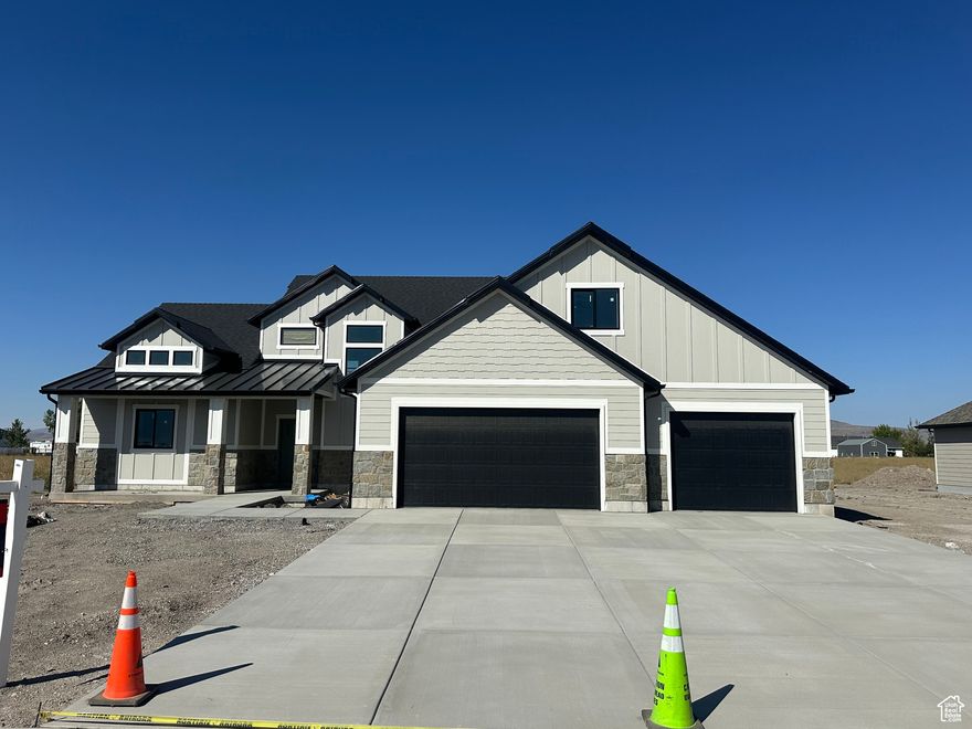 Welcome to country living at it's best.  This 2-story has all the upgrades included and you can bring the animals home!  Constructed with real stone on the exterior and is also inside on the fire place.  Custom cabinets, quartz tops throughout the house.  Island extended to a larger size. Butler pantry with countertops and outlets to hide all the small appliances. Gas oven and range.  2 tone paint with accent walls throughout as well.  Iron railing. Free standing tub in the master with personal toilet room, and two sinks, washer and dryer hook ups in the master closet and a laundry room upstairs.  4 bedrooms up stairs plus a family room and also a bonus room that could be used as a 5th bedroom upstairs.  Single living on the main level.  LVP in entry, family room and kitchen.  You still have time to pick your carpet.  Pattern tile in laundry.  Stairs will be trimmed out in wood. Just shy of an acre.  Home estimated to be complete by the 1st of September.