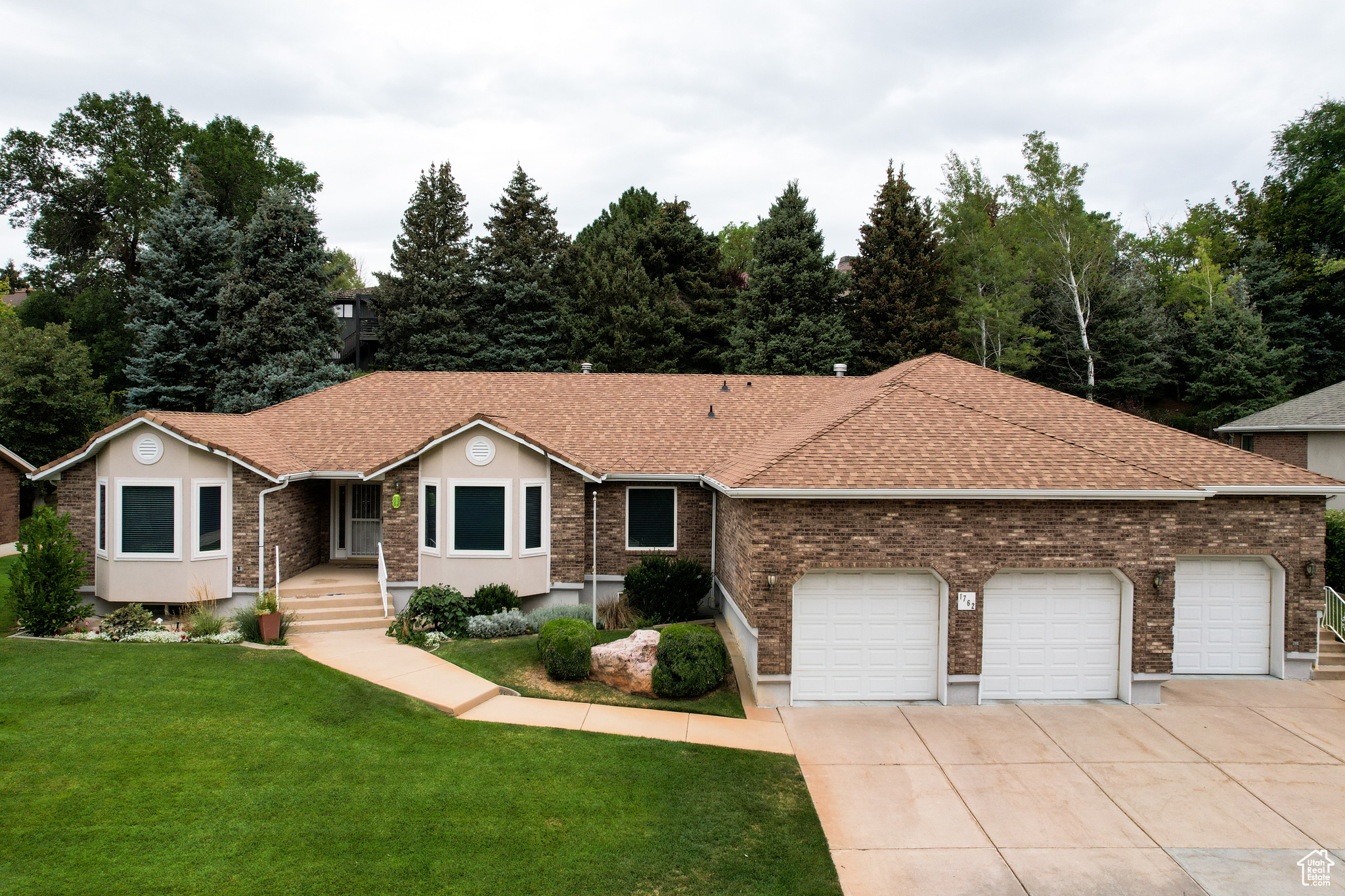 Don't miss this opportunity to secure this unique home in the a private and quiet gated community. This home has all of the space that you would need. Enjoy a well kept backyard, or the privacy of a full kitchen and family room in your basement. There are endless opportunities with this home. Featuring a private entry to a fully finished basement, where you are able to rent to someone else, or move in your family. Take advantage of this unique opportunity now!