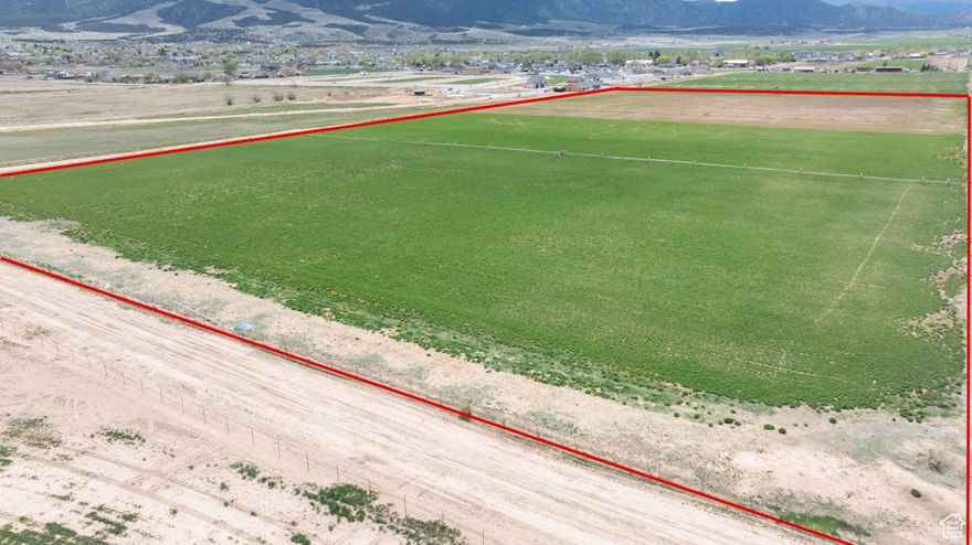 Prime 20-acre parcel in Enoch, zoned R-1-11 with excellent residential development potential. Sale includes 40 acre-feet of agricultural 1936 water rights, plus 39 additional acre-feet approved by Enoch City for 39 culinary  and pressurized secondary water connections. Flat terrain, mountain views, city utilities nearby, and no HOA. Ideal for subdividing into -acre lots or building a private estate. Convenient location near schools, services, and recreation. A rare opportunity for builders, investors, or those seeking land in a growing area.