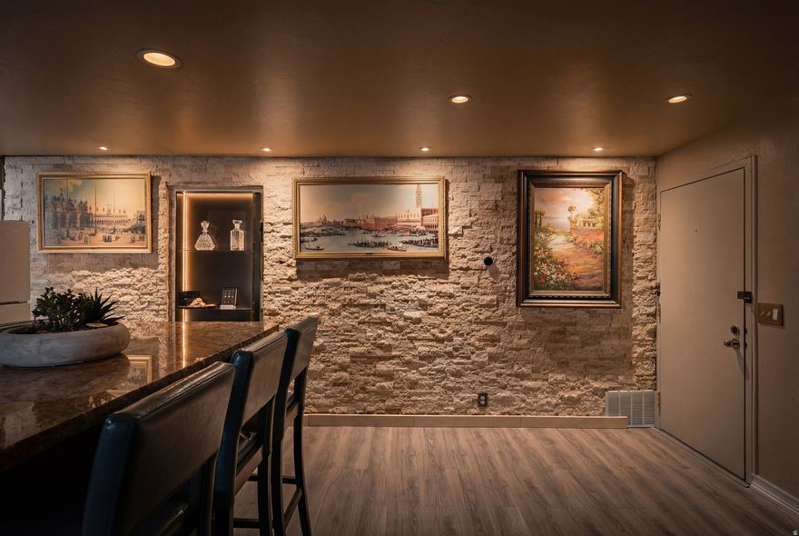 Beautifully updated main-level condo in desirable Quailbrook East! This 2-bed, 2-bath home features a stunning remodeled spa-style bath with freestanding soaking tub, designer tile, and modern finishes. Open living area with upgraded flooring, stone accent walls, custom kitchen cabinetry, and oversized island seating. Spacious bedrooms, private patio, and abundant natural light throughout. Enjoy resort-style amenities including pool, clubhouse, sauna, tennis courts, basketball court, and playground. Prime Millcreek location near shopping, dining, parks, and canyon recreation. Low-maintenance living at its finest!  Square footage figures are provided as a courtesy estimate only and were obtained from county records.  Buyer is advised to obtain an independent measurement.