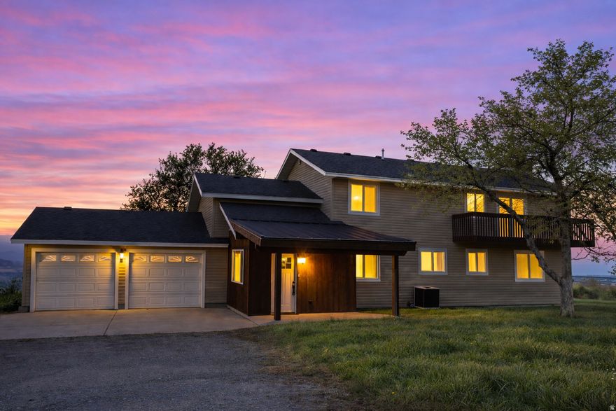 Experience the kind of 360-degree views that will make you stop and stare! Perched on 3 private acres in Paradise, this fully renovated hilltop home offers a rare combination of breathtaking Cache Valley panoramas, peaceful seclusion, and high-end finishes throughout. If you've been looking for a property that feels truly away from it all-without giving up comfort, style, or space-this is one you need to see in person.     Inside, every surface has been thoughtfully updated. The home features a beautifully remodeled open-concept kitchen and dining area, quartz countertops, hardwood floors, updated cabinetry, new mouldings, and quality finishes throughout. With multiple gathering spaces, including 2 large main level family rooms, 2 fireplaces, and an additional basement living area, there is room to entertain, relax, and spread out.      The upper level includes a spacious primary suite with incredible views, a custom shiplap fireplace, and private balcony access. You'll also find additional bedrooms, a dedicated office, and a generously sized room that works beautifully as a bunk room, game room, or flexible guest space.      The improvements go far beyond surface-level finishes. Major updates include the roof, siding, windows, doors, garage door openers, epoxy garage floors, a high-efficiency furnace, two A/C condensers, a water softener, and an electrical transfer switch for generator backup-creating a property that feels updated, dependable, and ready to enjoy from day one.        The setting is what truly sets this property apart. Though the parcel is 3 acres, it feels far bigger thanks to the surrounding open space and elevated homesite. Bring your horses, build a shop or barn, host unforgettable gatherings, and enjoy sunsets that simply have to be seen to be appreciated.      This is more than a home-it's a private-view property with the kind of setting and finish level that rarely come together. Come experience it for yourself.
