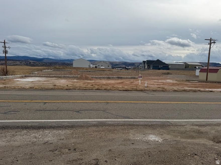 One of the last commercial / Industrial lots available in the Town of Manila!  Located right on Hwy 43 zoned at .47 acre but seller has piped and filled the property in, so its around 2 acres.  Great location for a business and / or a Residents. Property has two flat building areas divided by decorative 4x2 blocks.