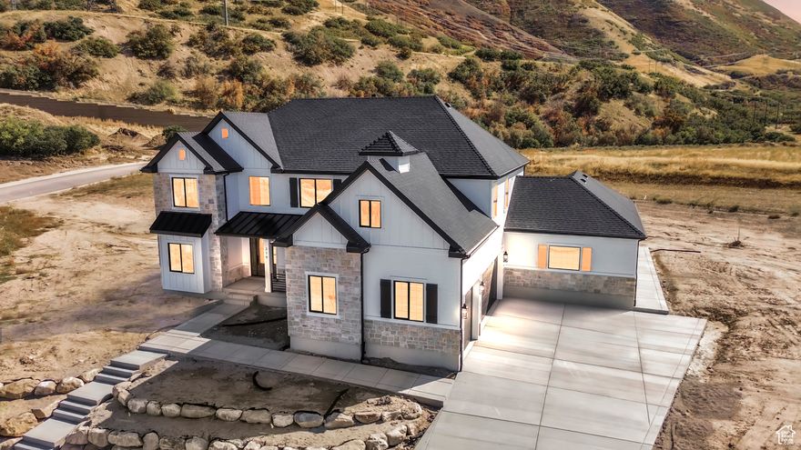 Beautiful luxurious home in the highly desirable Hidden Hollow neighborhood of Mapleton! Resting at the foothills of Maple Mountain, with views of the valley and majestic mountains. Featuring a spacious, fully finished floorplan that combines both form and function. Two kitchens, office on the main level as well as one adjoining the master suite. Tiered Theater Room in Basement, 9 foot ceilings, an abundance of windows to make it light and bright and bask in the 360 degree views. Aside from the quality features and finishes throughout, you'll love the 800 square foot sport court, perfect for racquetball, basketball and even a little pickleball or volleyball! Professional pictures will be added once complete. Be sure to take this opportunity to live in a truly amazing home in an incredible community!