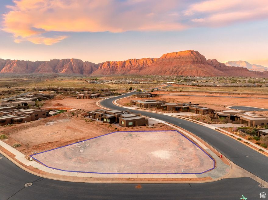 This is not just a homesite-it's a front-row seat to Southern Utah's most iconic landscapes, reserved for those who seek the extraordinary. With panoramic views of Red Mountain, the sculpted cliffs of Snow Canyon, and the evergreen peaks of Pine Valley Mountain, this property sets a new standard for luxury desert living. Located in an exclusive enclave of custom homes, the lot is ideally suited for a primary residence or an exceptional second-home retreat. The setting is both private and expansive, offering the perfect canvas for modern indoor-outdoor architecture and inspired design. Recreation is never far-spend your mornings exploring world-class trails, your afternoons kayaking or paddleboarding across serene desert reservoirs, and your evenings casting a line in tranquil waters under Southern Utah's expansive sky.  Premium view lots with this level of seclusion and access are increasingly rare especially those that offer such a commanding perspective of the region's most beloved natural landmarks.  Just minutes from award-winning golf, upscale dining, and boutique shopping, this homesite strikes the perfect balance between nature, luxury, and lifestyle.  Claim your place among Southern Utah's most breathtaking landscapes and start designing the life you've been dreaming of.