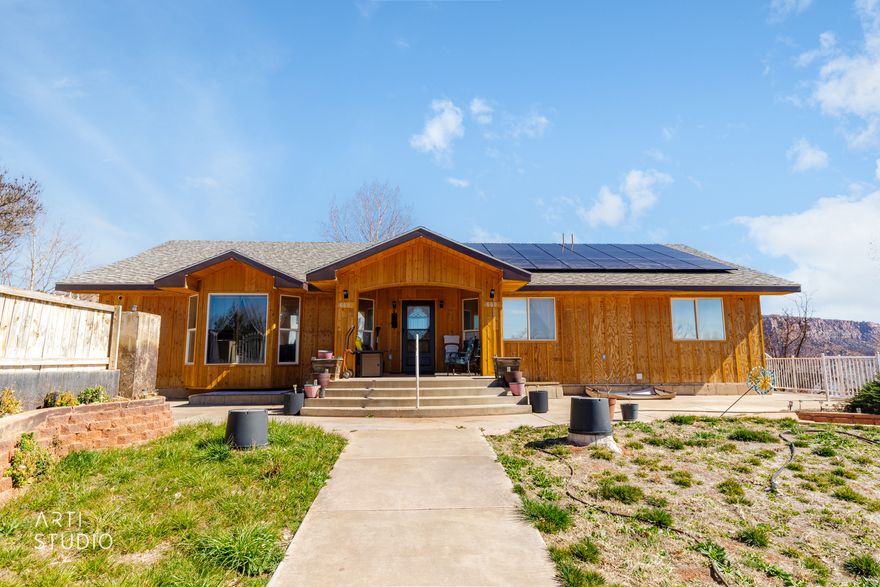 Distinctive Southern Utah property on .91 acres with sweeping views. Main level offers a bright kitchen with 14' ceilings, 4 beds, 4 baths, and laundry. Separate 4 bed/4 bath apartment below with full kitchen and laundry. Solar with battery adds efficiency. Space, flexibility, and income potential.