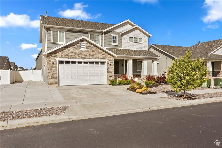 Mint Condition and Move-In Ready! This classic Craftsman style home features handsome exterior of stone, cement board siding, shingles and stucco, colorful easy maintenance front landscaping, and welcoming front porch. Main floor has spacious great room with gas log fireplace, accent wall with shiplap, 9' ceilings, 3-panel doors, lots of natural light, generous wrap-around kitchen with extra deep center island with pendant light / Quartz countertops / SS & black appliances (refrigerator included!) with natural gas line plumbed for the stove, central dining area, mud room off the garage, laundry room and half bath. Upstairs has large family room area with lots of storage in the built-in bookcases, primary bedroom has full bath and walk-in closet, 3 more roomy bedrooms and 1 full bath. Fully fenced backyard has covered & open patio areas, garden area. The 2-car garage has 8' garage door.  Walking distance to enjoy the in-ground pool, club house, gym and walking trails of the HOA. Quick access to the W Davis Corridor. Schedule via Aligned Showings.