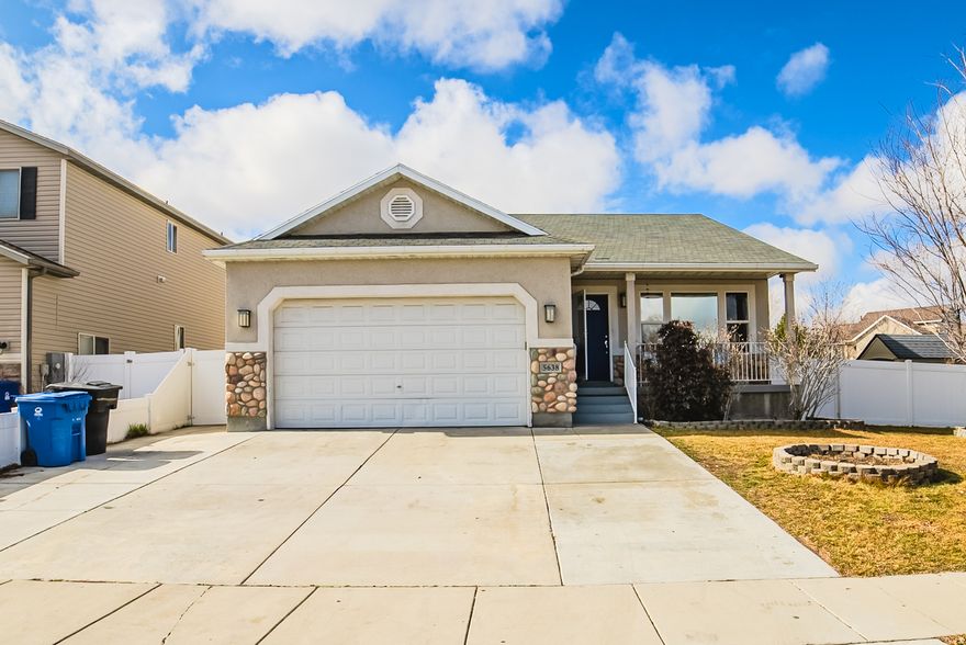 No showings until the Open House on Saturday, February 21st, from 11:00 AM  2:00 PM! Welcome to this charming Salt Lake City rambler situated on an ideal corner lot. This inviting home features an open floor plan with a spacious great room, beautiful faux wood flooring, and abundant natural light that creates a warm and welcoming atmosphere. Stainless steel appliances are included, and the home has been well-maintained. The primary suite offers an ensuite bathroom with a separate tub and shower for added comfort and privacy. The fully finished basement ADU provides excellent income potential, complete with a full kitchen, family room, three bedrooms, and a bathroom-ideal for rental income, multigenerational living, or guest space. Enjoy the fully fenced backyard with a large covered patio, perfect for relaxing or entertaining. Conveniently located near shopping, dining, Oquirrh Park, the Triplex Baseball Fields, Kearns Oquirrh Fitness & Recreation Center, and more, this home truly offers comfort, flexibility, and location all in one.