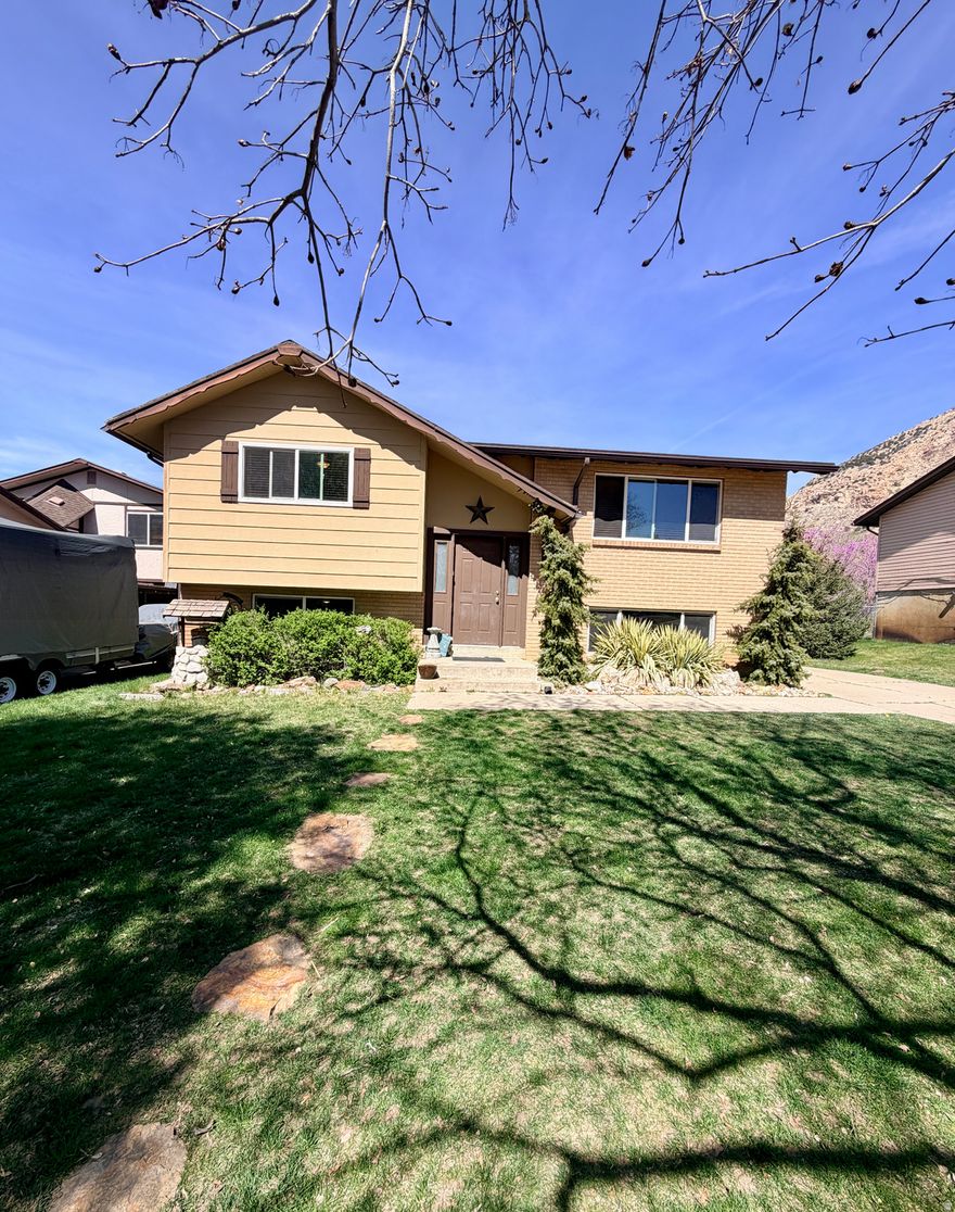 Tucked away on a quiet cul-de-sac in Ogden, this home offers the space, privacy, and access to the outdoors that so many buyers are looking for. As you walk in, you'll notice the new flooring throughout the entire home, along with fresh paint that gives everything a clean, updated feel. The layout flows easily into the main living and dining area, creating a comfortable space whether you're hosting or just enjoying a night at home. The kitchen features a new backsplash and sits right off the main living area, keeping everything connected and functional. With four bedrooms and one and a half bathrooms, there's already plenty of room, but the lower level adds even more flexibility. Downstairs, you'll find a large additional space that works well as a home office, rec room, gym, or even a potential fifth sleeping area depending on your needs. The walkout basement makes the space feel even more open and usable, and the oversized laundry room gives you extra storage and functionality. Outside, the fully fenced backyard offers privacy with no backyard neighbors, creating a space you can actually enjoy. The cul-de-sac location keeps traffic low and adds to the overall feel of the neighborhood. One of the best parts of this home is the setting. You're just minutes from the mountains, and you can see them from every window inside the home. With trails, hiking, and outdoor recreation close by, it's easy to enjoy everything Ogden has to offer.