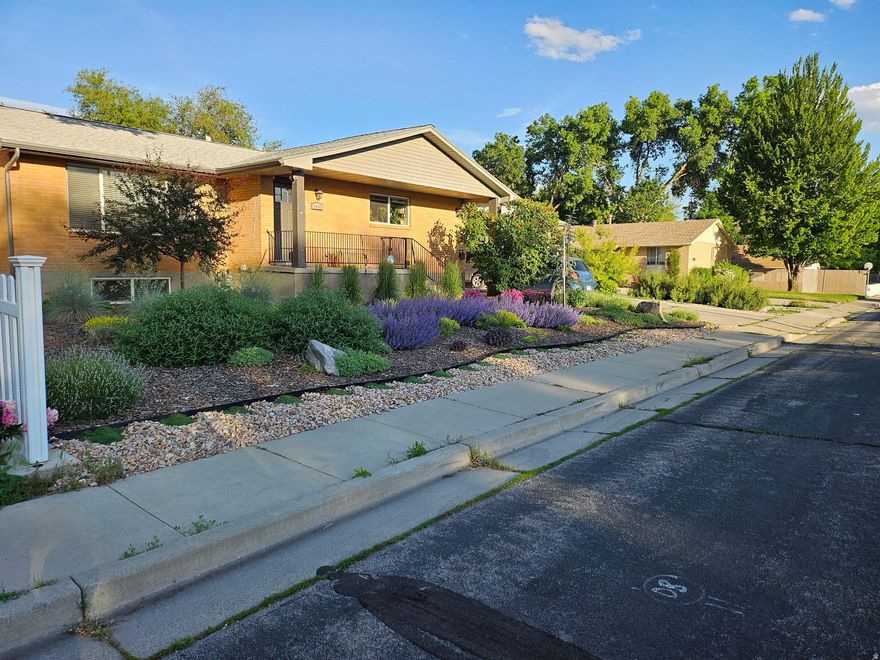 Lovely rambler in a quaint neighborhood in Salt Lake City.  Hard to find a home like this on almost a half-acre. This spacious 5 bedroom 3.5 bath home is close to everything... shopping, schools, parks, freeways. Plenty of room for a large family or you can rent the top or bottom.  New carpet throughout. All windows replaced in 2015, New Pex Plumbing in 2015. Electrical was updated with 200 Amp service. The garage is big enough for a mechanic or have your own workshop. The garage has a heater and a half bath. The home includes parcel 16-29-303-016-0000 where a nice shed sits. Bring your family and friends, you will love this home.