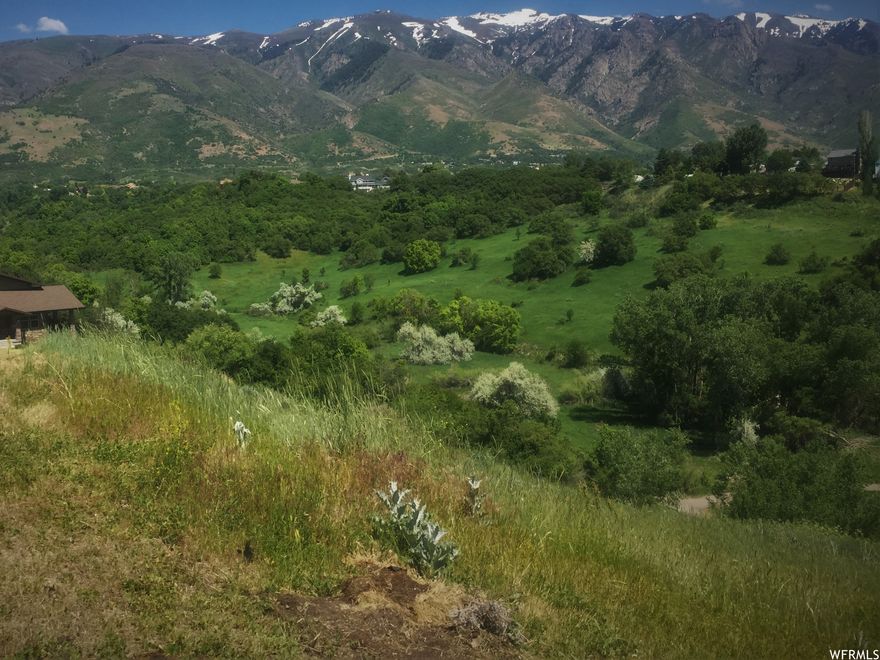Incredible unobstructed views - on just under an acre! This .91 acres lot is perfect for a walk-out basement and backs up to a beautiful nature preserve with spectacular mountain views of the Wasatch front. Below the lot is the Kays Creek Parkway Trail - a sweeping 2.8 mile long nature preserve that leads up to Hobbs Reservoir. City water and sewer are available at the entrance to the lot. Electric, gas, and high-speed internet utilities are already run to the lot. This property has Geotechnical Engineering Study and Topographical Survey work already completed. HOA for the area is inactive so there are no fees.