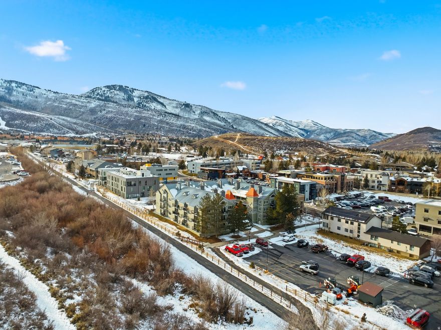 This beautifully remodeled two-bedroom, two-bath condo is ideally situated in Park City's desirable Prospector neighborhood. As a corner unit, it enjoys exceptional natural light, extra windows, and two private balconies-one of the best locations in the building. Step outside to immediate access to the Rail Trail, connecting you directly to Park City's extensive trail system and providing an easy route to historic Main Street. The walkable location puts shopping, dining, and nightlife just moments away, and the property sits on the bus route, making a car optional for residents and guests. Permitted for short-term rentals, the condo also includes a dedicated underground parking space and access to a community hot tub, offering convenience and comfort for both owners and visitors.