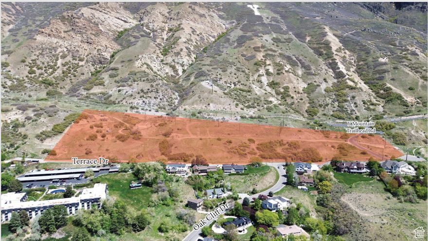 13.7 Acres close to BYU campus and the "Y" with incredible views of Utah Lake.   It is currently agricultural property but could potentially be rezoned into several residential lots. Sold as raw land and it currently has a cell tower lease.   Price is $73,000/acre or $1,000,000 total price and consists of 7 parcels being sold together.   Power sewer, telephone & water are all available in the lower Terrace Dr. street and in some places power boxes & phones on site.