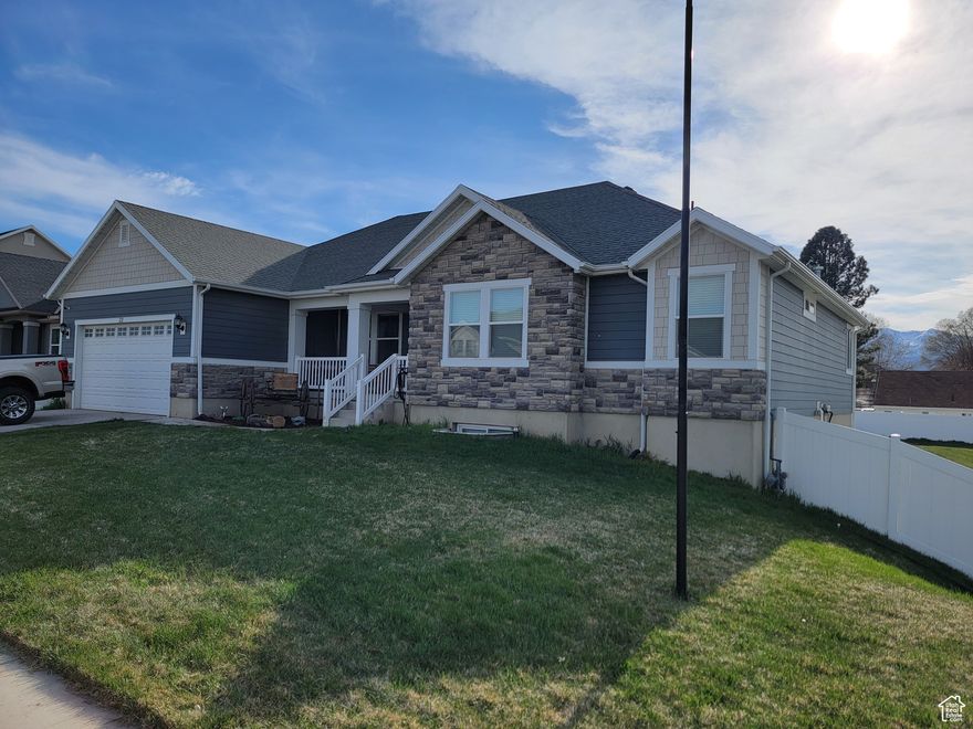 Beautiful rambler nestled in the heart of Heber City. Conveniently located near airport, ski resorts, and shopping. This home offers a large open floor plan with vaulted ceilings and plenty of natural light. Basement is finished with 3 bedrooms, a large bathroom with a 42' soaker tub and double sink with lighted mirrors. The basement has a large game room with dimmable lighting, a cold storage and storage room with shelving. The home offers two furnaces with UV lights, water softener and two water heaters. Master bedroom is on the main floor with large bathroom, separate shower and garden tub. Laundry room is located on the main floor. Kitchen has a large island, gas range and stove combo. Fridge included. Set on approx. .44 acres giving plenty of room to park boats, RVs and toys in the back yard. Property is fully fenced with a 12ft gate on the north side, two-man gates on either side of the home and a second man gate on the back side of the home. Home includes permanent lighting on the front, north side and back of the house. Don't miss out on this beautiful home. Square footage figures are provided as a courtesy estimate only and were obtained from county records. Buyer is advised to obtain an independent measurement.