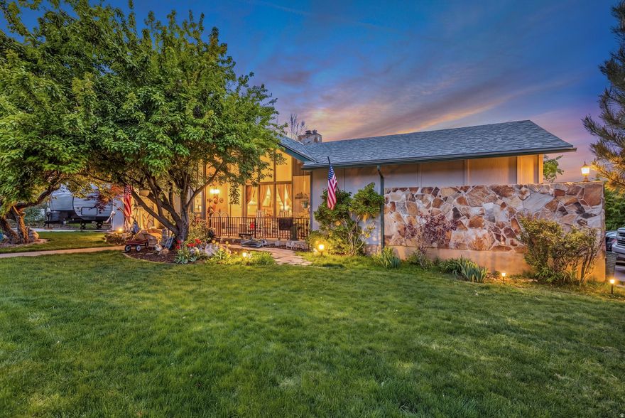 Stunning East Layton Rambler. Main Floor Living with Extraordinary Features! Close to Trails & Hill Air Force Base  Welcome to your beautifully updated rambler in the highly sought-after East Layton, ideally located near hiking trails and just minutes from Hill Air Force Base. Experience the convenience of true single-level living enhanced by thoughtful upgrades and an impressive list of additional features that make this home truly stand out.  As you step inside, you are greeted by a bright, open layout accentuated by soaring cathedral ceilings and a breathtaking floor-to-ceiling rock wall wood-burning fireplace, creating an inviting gathering space. The updated kitchen boasts elegant granite countertops, striking copper sinks, a double oven, and ample storage-perfect for daily meals and entertaining guests.  Retreat to the luxurious primary suite, complete with a spa-like master bath featuring a soothing soaker tub, a spacious shower equipped with dual shower heads, and a cozy gas fireplace for added ambiance.  This home prioritizes energy efficiency, thanks to owned solar panels that typically keep monthly utilities under $10.   The basement offers exceptional versatility with two bedrooms, ideal for relaxation or hosting guests. You'll appreciate the massive extra storage area, making it easy to keep your belongings organized. The expansive living room/game room is perfect for entertaining or spending quality time with family and friends.  Outside, the yard showcases mature landscaping, including a plum tree, grapes, a stunning Magnolia tree, and vibrant roses. Enjoy the convenience of extra storage with two sheds-one equipped with a workbench-and dual driveways, including covered RV parking for your toys or visitors.  This move-in-ready rambler combines comfort, convenience, and incredible value in a prime location. Schedule your showing today and don't miss this opportunity!