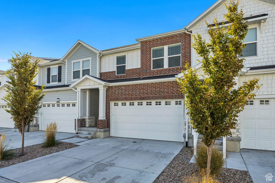 Step into this amazing townhome in Saratoga Springs' desirable Wildflower community where modern design meets thoughtful upgrades you won't find in new builds. This home features bright open spaces with soaring ceilings and large picture windows that frame unobstructed mountain and valley views. The kitchen showcases quartz countertops, designer lighting, stainless steel appliances, custom cabinetry, and tile backsplash with a timeless aesthetic. Upstairs, the spacious primary suite has a vaulted ceiling, en-suite bath and roll-down blinds-also featured in the living and dining areas for added comfort and privacy. Unlike nearby new construction, this home already includes valuable additions such as a premium water softener, 240V EV charging port in the garage, and window coverings throughout-making it truly move-in ready from day one. The walkout basement is a rare highlight, offering incredible potential for future living space and direct outdoor access. Enjoy the Wildflower lifestyle with miles of walking trails, pools, off-leash dog parks, playgrounds, a private community lake, pickleball/volleyball courts, and open space, all within minutes of local schools, shopping, and Utah Lake-offering the perfect blend of new-build freshness, convenience, and everyday livability.