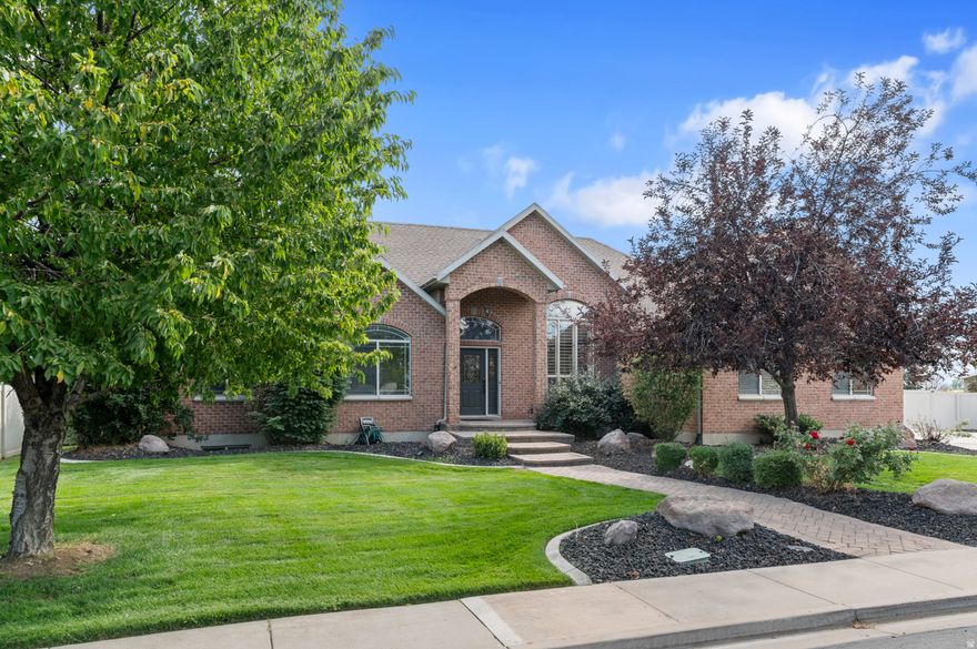 Mountain Views, Swim Spa, Entryway office & Theatre Room! Welcome to your dream home. This spacious **7-bedroom, 3.5-bathroom** residence is designed with both entertaining and everyday living in mind. Step inside to find a newly updated master bathroom featuring a 6-foot soaking tub, easy access shower and dual vanities. The home also boasts dual Laundry rooms for added convenience and a separate basement entrance-ideal for multi-generational living or future rental potential. Whether hosting or unwinding, hit the Theatre room for movie nights, featuring a Wet bar, projector, and built in sound equipment. Family-friendly yard with a cozy stone firepit, tranquil water feature, swing set, and plenty of space to play You'll also enjoy **ample parking** for all your vehicles, toys, or guest and no HOA restrictions holding you back!