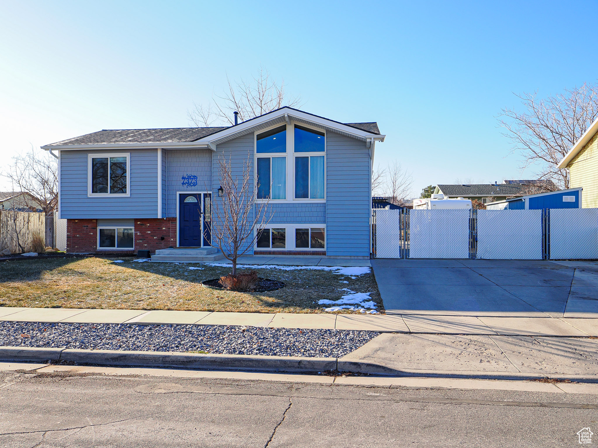 Beautifully updated & meticulously kept Magna home. Entertain indoors or out with covered deck and patio, as well as gathering places including a concrete pergola area and fantastically landscaped design. Inside you'll find a tastefully updated kitchen/dining area along with spacious family room and updated bathroom.  Downstairs boasts a spacious family room, updated bathroom and bedrooms. New concrete patio, new concrete in front of the house, New Water Heater and much much more! RV Parking fits all of your Recreational needs including 2 storage sheds. Square footage figures are provided as a courtesy estimate only and were obtained from County Records.  Buyer is advised to obtain an independent measurement.