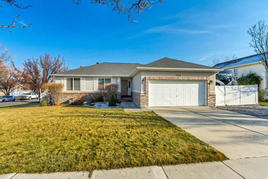 This charming, completely updated rambler in West Jordan boasts a fabulous corner lot with mature trees and a great, fenced backyard perfect for entertaining! The property offers stunning mountain views from the new 13'x20' paver patio and a new 14'x14' concrete hot tub pad! Inside, the home features all-new ceramic tile floors, new paint, and new wall texture on the main level, complemented by new floor and door moldings and recessed lighting throughout! The beautifully remodeled kitchen is a chef's dream, showcasing new high-end appliances, granite countertops, custom cabinets with task lighting, and a wonderful walk-in pantry complete with built-in drawers and appliance storage! The remodeled master bath provides a spa-like experience with a custom shower and vanity! Significant updates extend to the home's infrastructure, including a new roof (2024), a new owned and paid-for solar system (2025) which eliminates the electric bill, a new water heater (2025), a solar-powered attic fan and more! Conveniently located near schools, restaurants, and shopping, the property also offers 47' of RV parking ! This home perfectly combines modern luxury with practical, energy-efficient living. Buyer to verify all listing details.
