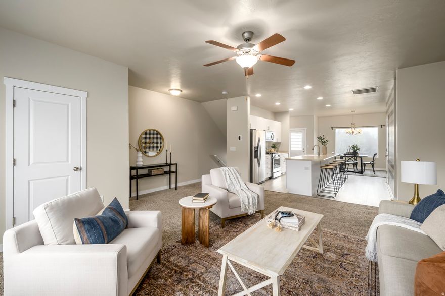 This beautiful 4 bedroom 3.5 bathroom townhome features a private bedroom and a full bathroom on the main floor.  Perfect for guests, multigenerational living or a home office.  The second floor showcases an open concept living room and new flooring in the kitchen/dining with a spacious island and all appliances included.There is a balcony off of the dining room overlooking the nearby playground and dead end street. Upstairs are the remaining bedrooms along with the updated laundry room.  Enjoy plenty of parking in the two car garage, driveway and on street parking. Easy freeway access, close to restaurants and shopping, so much to like with this great townhome!