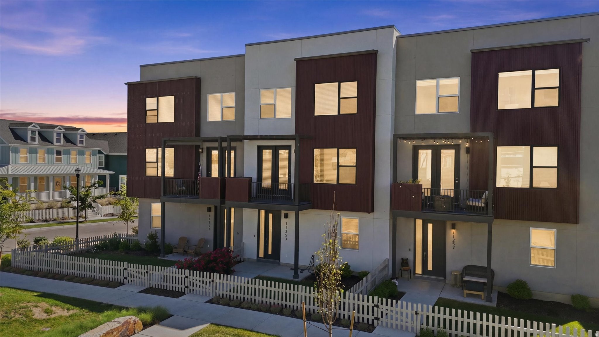 Modern townhome exterior featuring clean lines and a complementary color palette