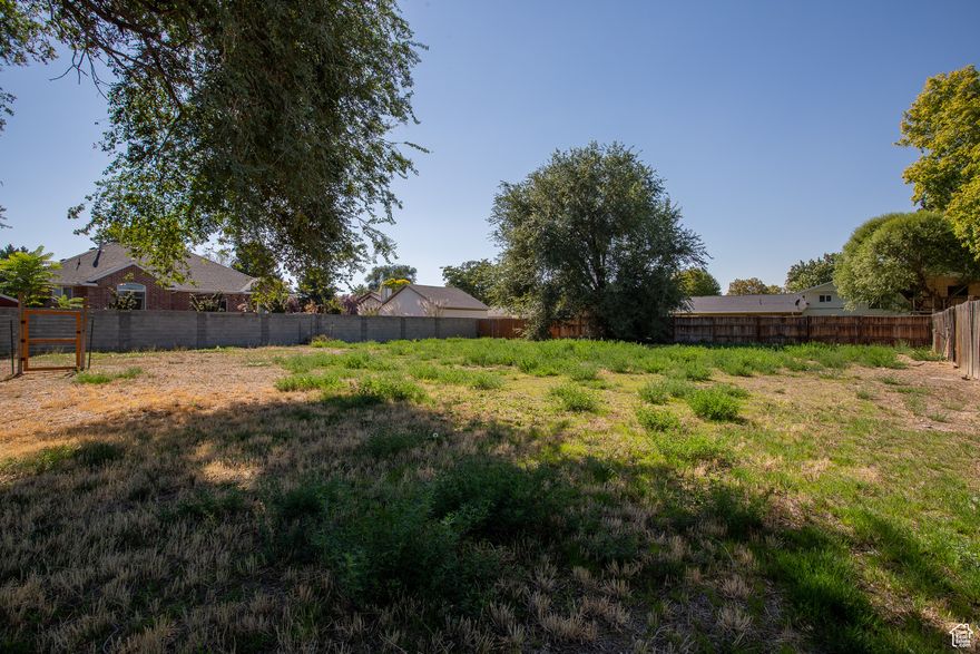 Vacant, flat flag lot behind 8686 S. TEMPLE DR (1300).  Could be purchased in conjunction with MLS 2118840.  If to be built on, all utilities would come from 1300 W. Great lot to build on or store work equipment or toys. Possible seller finance available on this additional lot, if purchased in conjunction with the home.