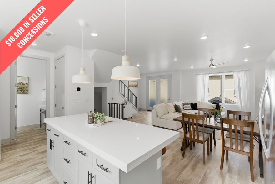 OPEN HOUSE Saturday 11:00 AM  2:00 PM. Seller now offering $10,000 in buyer concessions toward closing costs or an interest rate buy-down. Beautiful Daybreak townhome located in Highland Park Village offering modern design, energy-efficient features, and low-maintenance living. This well-maintained 3-bedroom, 2.5-bath home features an open-concept layout ideal for both everyday living and entertaining. The bright kitchen flows seamlessly into the main living space and opens to a covered deck - perfect for relaxing or grilling.  The spacious primary suite includes a walk-in closet and private bath, while additional bedrooms provide flexibility for guests, a home office, or family living. A large 2-car attached garage provides extra storage and everyday convenience.  Built with efficiency and smart living in mind, this home includes high-efficiency HVAC, a tankless water heater, and energy-saving features designed for comfort and lower utility costs.  Enjoy the Daybreak lifestyle with access to miles of trails, parks, lakes, community pools, fitness amenities, concerts, farmers markets, and year-round community events. Conveniently located near shopping, dining, schools, and Mountain View Corridor for easy commuting.  Square footage figures are provided as a courtesy estimate only. Buyer is advised to obtain an independent measurement.