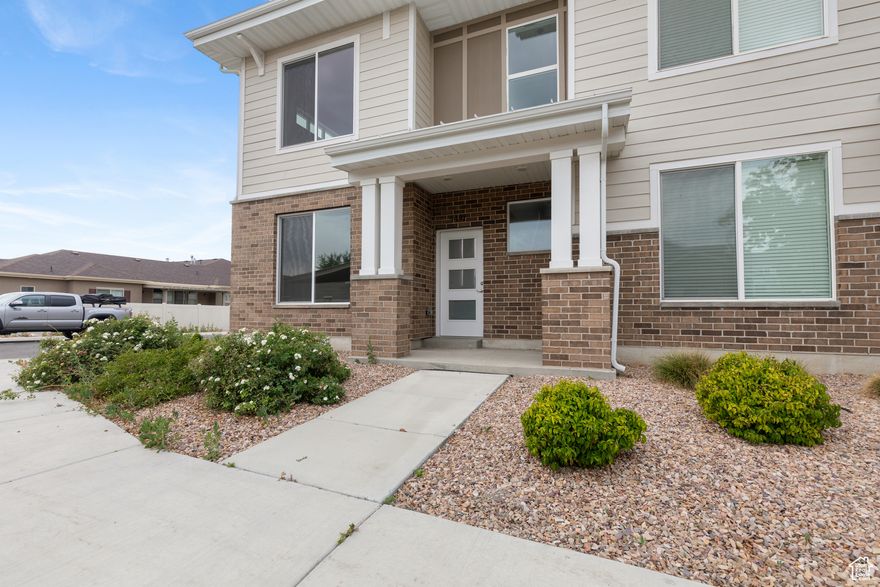 Perfect End-Unit with large 2-car garage! Quartz tops throughout, large walk-in closet, master bath with large tile shower.  This unit sits in the back of the project with no drive through traffic, driveway parking as well!