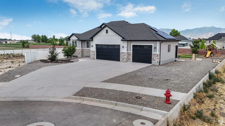 ***** Seller is wiling to contribute $10,000 towards Buyers Closing Costs, Rate Buy Down or Price Reduction*** We are very excited to introduce you to our newest Grantsville Listing! This beautiful Rambler has it all! Built recently, this modern rambler is equipped with 6 bedrooms, finished LARGE basement and on top of that, it is situated on a .5 ACRE fully landscaped and fenced lot! Talk about Ready to Move-In! You will see the love and care the owners have put into this home, and how easy it is to fall in love with it yourself! Owners recently installed Solar Panels to save you money as well. Did I mention that home has had all flooring recently replaced and comes with all the appliances? The basement has all the plumbing for a huge kitchen that could even be rented out for more added value! Come enjoy the serenity and peaceful living that Grantsville has to offer! 1 SHARE OF GRANTSVILLE IRRIGATION COMES WITH EVERY LOT.