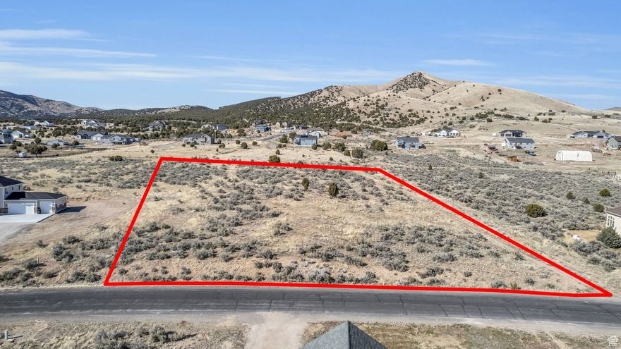 Take a look at this beautiful 2.42 acres located in The Benches at South Rim. Placed in a peaceful neighborhood only 15 minutes from Tooele, this lot is an open canvas to build your forever home. No HOA, great views of the Oquirrh & Stansbury  Mountains, & ideal south facing lot are some of the most desired traits for this property. Option for home plans if desired.  Tooele county has the PERC test results for the septic and the survey is updated and ready to build.