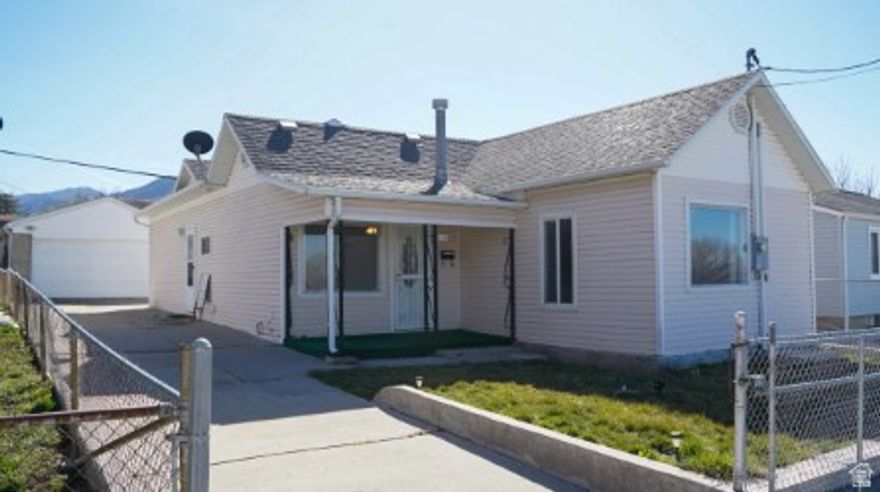Step into charm with this adorable 3 bedroom, 1 bath home in Tooele!  Built in 1910, this cozy home blends character with comfortable everyday living.  Warm and inviting spaces make it easy to feel right at home.  The detached 2 car garage adds extra storage and flexibility, and the yard is just the right size to enjoy without a lot of upkeep.  A great opportunity for anyone that loves the charm of an older home at a great price. Freestanding wardrobes in bedrooms are included.  Buyer is advised to obtain an independent measurement.  Figures shown are provided as a courtesy and obtained by county records.