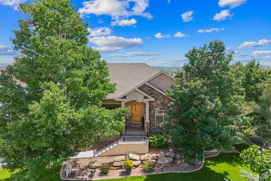 If you're looking for a welcoming neighborhood, take a walk through this clean, spacious 5 bedrooms 3.5 bathroom home in the Wild Willow subdivision. The community features horse properties with private trails and a 2.5-acre riding arena. This home sits on a . 51-acre lot and is located in a quiet cul-de-sac, the property is zoned for horses and has space for recreational trailer parking. A 26x36 detached garage offers ample room for storage and toys. The main level includes an open layout connecting the living room, kitchen, and dining area under vaulted ceilings. Just off the entry, there's an office with a sliding barn doors. A covered deck, accessible from the dining room, extends the living space to the outdoors. The primary bedroom has double doors and spacious ensuite bathroom with walk in closet. The lower level is configured as a mother-in-law apartment with a private entrance and lots of light. It includes two bedrooms, one bathroom, a bonus room, laundry area, cold storage, and an open kitchen and living area. Outside, the property features a six-person hot tub and a custom fire pit with built-in seating. Wild Willow sits just 20 minutes from East Deer Valley skiing, close to Jordanelle Reservoir and near the Uinta National Forest, offering easy access to skiing, hiking, biking, boating, and fishing. Reach out to see all the possibilities!