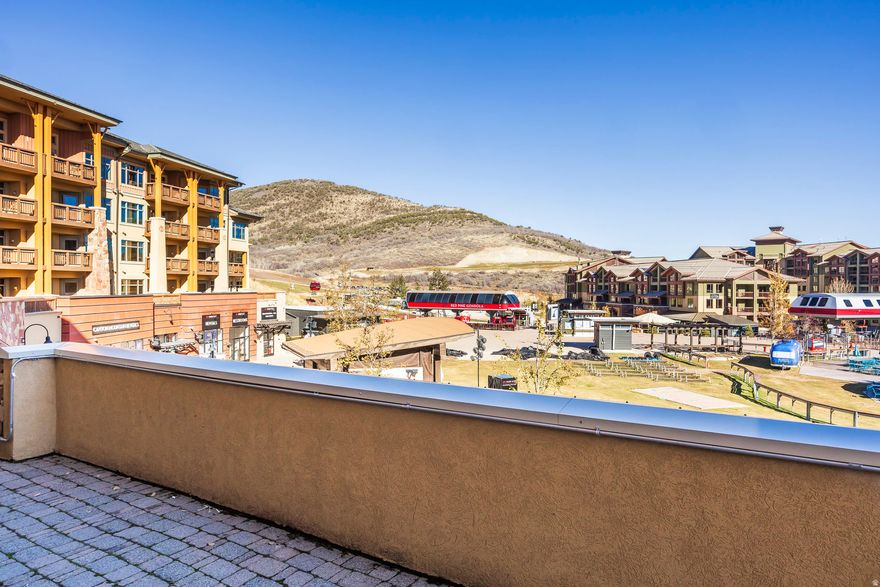Experience unparalleled ski-in/ski-out luxury at this exceptional 2-bedroom, 2-bathroom condo located at 3720 N Sundial Court, Unit B203. With 1,121 square feet of meticulously designed living space, this fully furnished residence is just steps from the ski lifts at The Canyons Village at Park City Mountain Resort, offering true resort-style living. The unique lock-off capability provides incredible flexibility, allowing the unit to function as two separate rental spaces or a connected single home, maximizing both rental income potential and personal use. Step outside onto your private balcony to soak in the vibrant atmosphere, with direct views overlooking The Forum, the epicenter for lively summer concerts and all the exhilarating winter resort events. Designed for convenience and comfort, the home includes coveted in-unit laundry, an owner's dedicated storage closet for personal gear, and a heated underground parking space to protect your vehicle from the elements. This is a turnkey opportunity; offered fully furnished for immediate enjoyment, and with short-term rentals permitted, it represents an ideal investment. The hands-off homeowner's association handles all exterior maintenance, ensuring a truly worry-free vacation home or high-performing ski rental property. This property is your gateway to world-class skiing and the vibrant lifestyle of Park City.