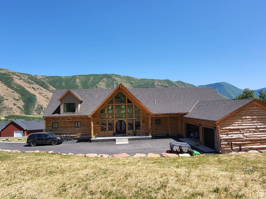 One of a kind custom home in Hobble Creek Canyon. This is a once in a lifetime opportunity to own one of the most beautiful homes on one of the most beautiful properties in the canyon. Hand split log exterior. 50 year GAF custom roof shingle with 25 year labor warranty. High quality Marvin windows. It's the only home you'll see with real copper gutters, leaders, soffits and fascia. Copper was clear coated to maintain original shiny copper. Although the home is 12,000 sq', it's so efficient that we only use 1 tank of propane per yr (propane is for heat, dryer and stove). Amazing views from every window! First floor has huge open kitchen, dining, family room with windows going up almost 30' for a spectacular valley and mountain view. Kitchen has unique geode counter tops, custom copper sink and hood, Fisher Paykel appliances. Wood burning fireplace in family room area with 12' granite slab. Master bed/bath is on the east side of this room. Has gas stove, large glass slider to private deck. Master bath has shower made of 3 slabs of granite, no seams, marble floor, large jetted tub. Half bath and large laundry rm located south of kitchen. 2 bedrooms, bathroom and garage located west of kitchen. Wood floors throughout first floor. 2nd floor has Karastan carpet and the best carpet padding. Ceiling is 8,000 sq' of hand sanded, hand stained tongue and groove cedar planks. Walkout basement has full professional gym, a large granite slab with petrified trees and shellfish, plus plenty of room for whatever your heart desires. Small stable next to house with radiant heated floor. Greenhouse by house also. Red garage is 5,000 sq' with 7 doors. Can hold 20 cars or more. Doors large enough for motorhome or trailer to pull through. No backing up. Full hook ups outside garage for camper or motorhome. Half bath with granite floors and heated bidet seat inside garage. Grey garage is by lower cabin, approx 3,000 sq', we keep tractors, landscaping, tools, etc in it. Cabin was originally built in the 1800's, then rebuilt in the 1960's using the original wood for the interior living room walls, awesome! Kitchen, living room, bed and bathroom are on 1st floor with large loft upstairs. New 900sq' deck with seasonal creek running below. Surrounded by 3 acres of lush grass, looks like a mini golf course. Sprinklers are automated. Junior water rights to spring. All 4 structures have Springville city water. One of the few properties in canyon, not in HOA, that has city water. This is 5 min past the Hobble Creek Golf Course, you can drive your golf cart there! Come see why everyone says that living in this canyon is Magical Price is non negotiable   Square footage figures are provided as a courtesy estimate only and were obtained from tax records.  Buyer is advised to obtain an independent measurement.