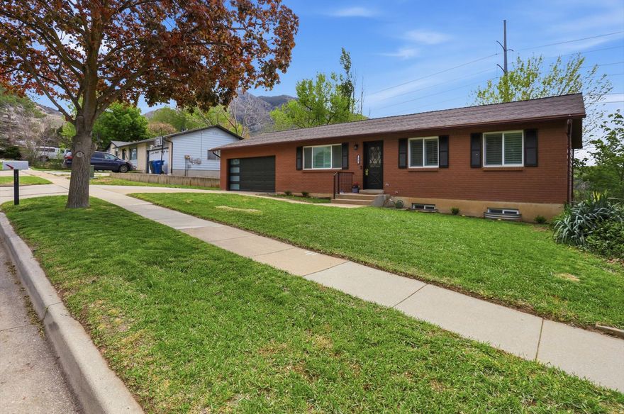 **OPEN HOUSES - Wed. 4/22 & Fri. 4/24 - 4PM to 7PM & Sat. 4/25 - 10AM to 1PM** Beautifully updated rambler tucked in a quiet neighborhood at the base of the mountains. This home offers a functional and flexible layout with 3 bedrooms on the main level and 3 additional bedrooms in the fully finished walkout basement. Enjoy a remodeled kitchen and bathrooms, new LVP flooring on the main, and brand new carpet throughout. Major systems have been upgraded with a $30,000 heat pump furnace and central air, plus the added benefit of fully paid solar for energy efficiency. Take in stunning mountain views from the spacious backyard, all while being conveniently located near trails, schools, and shopping.