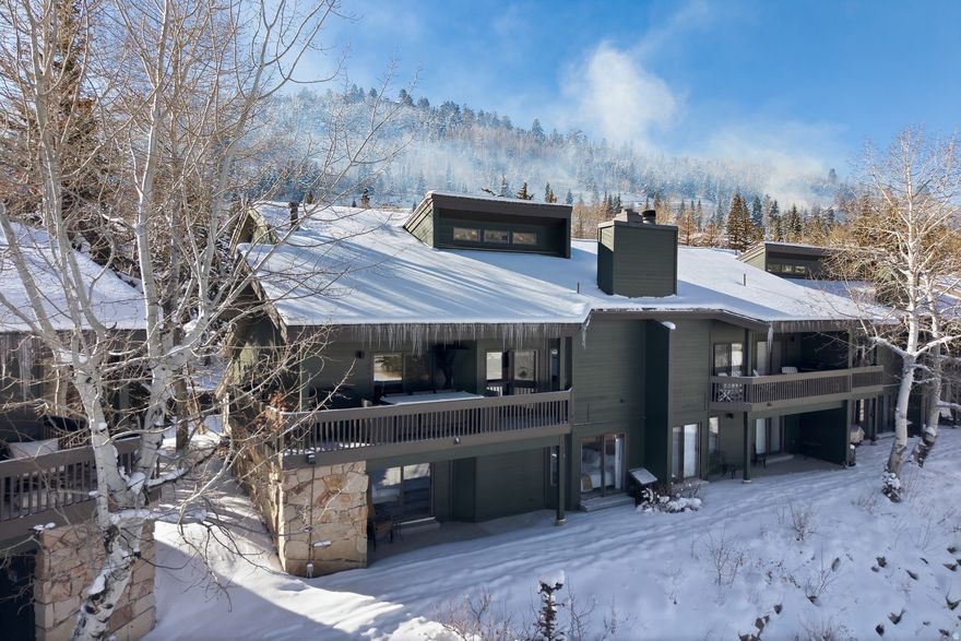 Perfectly positioned in the heart of Lower Deer Valley, this beautifully reimagined 4-bedroom Lakeside townhome offers a rare combination of serene pond views, walkable convenience, and refined mountain living. Ideally situated between Snow Park Lodge and Park City's Historic Main Street, the location delivers effortless access to skiing, dining, shopping, and year-round recreation. Completely remodeled in 2023, the residence showcases high-end finishes throughout, including wide-plank European white oak flooring, premium granite and quartzite countertops, and top-tier appliances that elevate both form and function. The open-concept main level is designed for gathering, with a welcoming living area and seamless flow to generous deck space overlooking the tranquil Deer Valley ponds - an ideal setting for morning coffee or aprs-ski evenings. The thoughtful layout includes a spacious primary suite and two additional bedrooms, offering comfort and privacy for family and guests alike. Large windows bring in natural light and frame peaceful outdoor views, reinforcing the home's connection to its surroundings. Lakeside residents enjoy exceptional amenities, including a year-round heated pool, hot tubs, sauna, and an on-demand door-to-door skier shuttle to Snow Park Lodge. With ongoing HOA improvements and proximity to hiking, biking, skiing, and Main Street, Lakeside continues to be one of Deer Valley's most desirable and beautifully maintained communities. Whether used as a primary residence, mountain getaway, or investment property, this turnkey Lakeside townhome delivers timeless style, unbeatable location, and true year-round enjoyment.