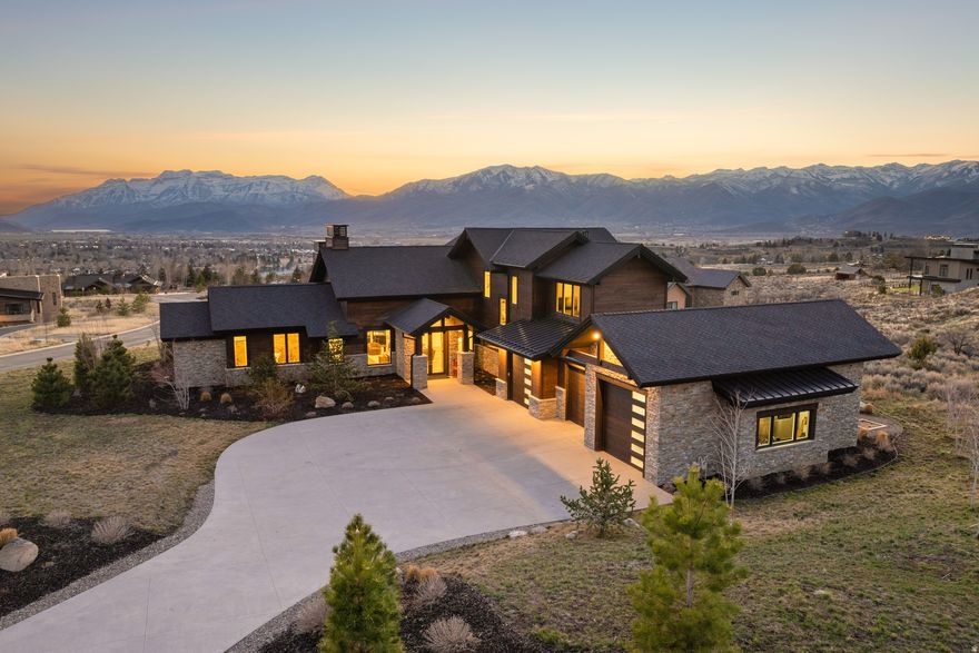 Thoughtfully designed and built by JD Construction, this 3,696 square foot residence offers four bedrooms and four and a half bathrooms on a generously sized homesite of over one acre. Designed by Kevin Price, the home blends refined mountain architecture with high-end finishes throughout.  The open-concept living space is anchored by a chef's kitchen featuring premium Wolf appliances, seamlessly connecting to the great room and outdoor living areas--ideal for both everyday living and entertaining. The primary suite is a true retreat, highlighted by a spa-inspired bathroom with a custom double shower, heated floors, and bidet fixtures throughout the home for added comfort.  Additional features include a large heated driveway for year-round convenience, an oversized heated three-car garage, and a private hot tub to enjoy the surrounding mountain setting.  Located within the private, gated community of Red Ledges, residents enjoy world-class amenities, including a Jack Nicklaus Signature Golf Course, Golf Park, tennis, swimming pools, pickleball, fine dining, an award-winning fitness center, an equestrian facility, and a ski program complete with seven-day-a-week shuttle service to Deer Valley East Village.