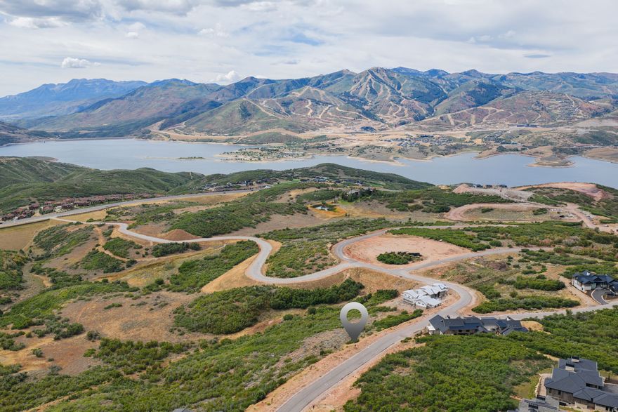 Positioned to capture a stunning, head-on view of Mount Timpanogos, this 0.54-acre downhill, easy-build homesite in the prestigious Golden Eagle community offers a rare opportunity to frame one of Utah's most iconic peaks from your future mountain retreat of up to 7,000 sq ft.  Golden Eagle encompasses 600 acres, with 25% preserved as open space, ensuring a community that celebrates natural beauty and privacy. Residents enjoy miles of private trails and a planned clubhouse with indoor/outdoor gathering areas, a kitchen, and a fire pit. With its restrictive nightly-rental policy, Golden Eagle provides a tranquil, residential lifestyle.  Ideally located just 15 minutes to the new Deer Valley East Village, a short drive to Park City's Historic Main Street, and 35 minutes to Salt Lake International Airport, this lot blends everyday convenience with a truly one-of-a-kind Timpanogos view.