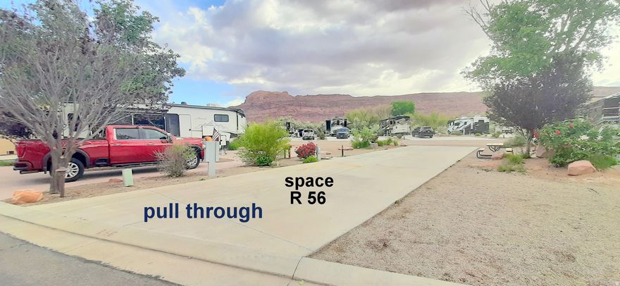 Own a piece of the Rock! Or just enjoy owning this nightly RV rental investment spot at the Portal RV Resort by Roberts Resorts has rebranded to Village Camp Moab. Yes, it is a pull through lot for easy parking and easy hook ups. This large concrete pad 87' long x 20' wide fits your extra large RV and a casita can be built in this area and still have room for your motor home, A graveled area 18' wide x 22' deep side space is a great place to park your tow behind vehicle or visitor parking. Rubicon Trail 56 is located close to the pool, hot tub, pickle ball court, the pond, laundry service area, men's & ladies bathrooms, the exercise gym and the pathway to the dog park. Enjoy views of to the western views of the Colorado River's famous Portal, southeast, views of the La Sal Mountains, eastern and west views of the Red Rock walls of Moab and the views of the Portal Pond. There are open areas with paths leading to seating areas that take in the views and or are a great place to read a book. When you are not in town, The management of this park can rent out your investment property for you. This is an easy, carefree investment, securing a place to park your RV when in the Moab area. Acreage figures are provided as a courtesy estimate only and were obtained from county records. Buyer is advised to obtain an independent survey measurement. The fees include basic cable, pool and grounds maintenance. http://www.portalrvresort.com/rules---regulations.html