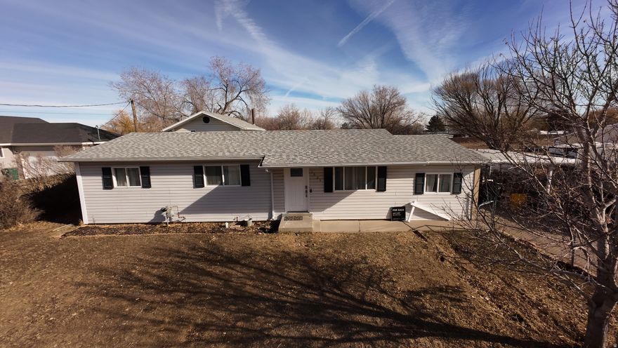 Beautifully updated home on a spacious 0.69-acre lot in Vernal, featuring extensive renovations completed in 2020 and thoughtful improvements throughout. The interior was completely redone with new sheetrock, flooring, lighting, and a fully remodeled kitchen with granite countertops, under-cabinet lighting, and a generous butler's pantry offering abundant counter space. Enjoy built-in banquet seating with hidden storage, wall heaters in both bathrooms, and a tankless water heater. Central air and all new heating, air units, and ductwork were added in 2020. The third bedroom is ideal for creative or work-from-home use with double insulation for sound design and an "On Air" light, plus crawl space access located in the closet. Major updates include a new roof in 2023, three new exterior doors (one with a small doggy door), updated plumbing for the washer and water heater. Outside, the property shines with a firepit and built-in seating, gazebo with hot tub (Electrical hookups needed), garden beds, mature lilac bushes, mature apple and plum trees, young pear, peach, and cherry trees, a fenced chicken coop with large shed, a 2-car carport and RV parking-perfect for enjoying space, privacy, and country living with modern comfort. Square footage provided as a courtesy only and was obtained from previous MLS listing. Buyer to verify all information.