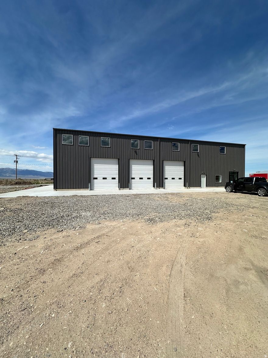 10,000 Sq. Ft. on 5.81 acres -7,500 Sq. Ft. Warehouse -2,500 Sq. Ft. Office Additional 3,000 Sq. Ft Mezzanine (Not included in total square footage) Three (3) - 12' x 14' GL roll up doors One (1) - 10' x 10' GL roll up door Two (2) - Dock doors Office includes three (3) temperature controlled offices additional 5 acres of graded land available @ $0.05 PSF Power 400 amps/ 208V/ 3 Phase  Zoning: LI (Light Industrial) Radiant heating in warehouse Clear height: 21' - 30' Washroom Shower room Breakroom Two (2) bathrooms