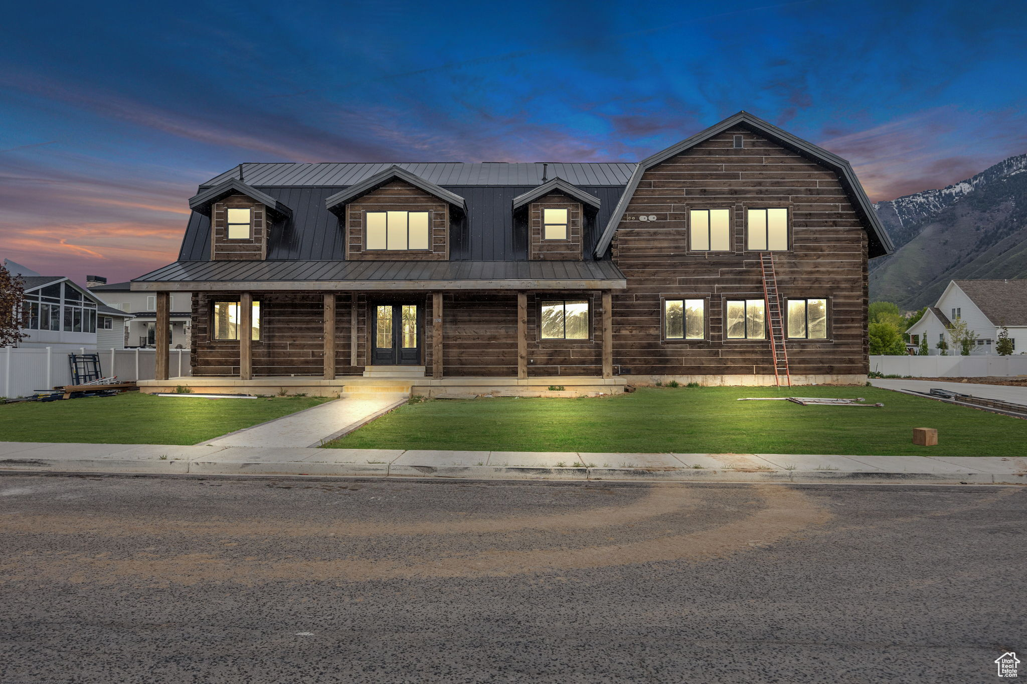 Stunning custom stacked log home featuring a spacious main-floor Master Suite, main-floor Gourmet Kitchen, elegant finishes in every room, and luxurious craftsmanship throughout your home. Your home has eight bedrooms, six bathrooms, and three kitchens with quartz countertops, custom cabinets, and stainless steel appliances. Bonus features include a two-bedroom, one-office or craft room, one bathroom, and a mother-in-law apartment on the lower level. Modern 2-bed, 1-bath, 700 sq ft legal apartment above the garage. Thoughtfully designed with custom finishes, efficient layout, and upscale touches throughout. Ideal for rental income, guests, or multigenerational living. A perfect blend of style and functionality! A rare blend of rustic charm and contemporary comfort nestled in a one-of-a-kind setting! The seller is offering a $50,000 incentive towards landscaping. Schedule your showing today! The Kitchens and Master Bedroom have been virtually staged. Buyer and buyer's agent are responsible for verifying all information. Square footage is estimated as a courtesy based on County Records; buyers are encouraged to obtain an independent measurement.