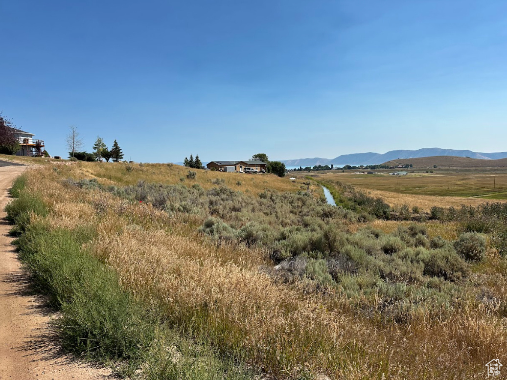 New Price! Build Your Dream Getaway at Bear Lake Wake up to panoramic views of Bear Lake and the surrounding valley from this premium lot in the desirable Golf Course Subdivision. With year-round recreation at your fingertips-boating, hiking, golfing, and more-it's the perfect spot for a cabin or second home. Optional access to Ideal Beach Resort gives you private sandy beaches and fun amenities just minutes away. The lot sits near the clubhouse and could soon back onto the future golf course expansion. HOA-approved building plans are available to help you start building faster. Buy this lot alone or bundle it with the neighboring parcel (MLS # 2107977). Come take a look-schedule a private tour today!