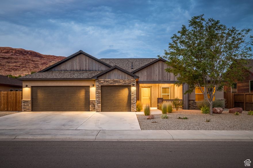 PICTURE PERFECT IN THE PRESERVE- Where the Moab Portal views take your breath away on a daily basis.  This quiet neighborhood houses this meticulously maintained modern-rustic home with stained cedar, stacked rock and stucco exterior - enhanced with a soft and earthy interior.  A quaint front patio with an herb garden welcomes you into the formal entry. This home features a remote main bedroom suite, with a dual head walk-in shower, adjacent to the bright, open and airy kitchen featuring quartz countertops, custom cabinets and trim, as well as chic appliances. The kitchen, formal dining, and living areas enjoy gorgeous stained concrete floors. This lovely floor plan with two additional bedrooms and full bathroom offers exceptional storage with a pantry, laundry/mud room and an oversized 3-car garage with work benches and attic storage.  Fiber optic internet, TV connections in all bedrooms, hard-wired surround sound, up/down window shades, hot & cold exterior water spigot, new roof, and new A/C condenser are a few of the wonderful upgrades this home has to offer. Relax under the Swiss Cheese Ridge view on the covered patio with shade sails, gas BBQ connection, and a gas fire pit perfect for gatherings. The expertly designed backyard is fully fenced with charming garden beds, superb flower beds, and a playful lawn. Located in Moab's northwest corridor, you will enjoy stepping out your front door and having phenomenal access to the paved bike and pedestrian path directly to Arches National Park and the mighty Colorado River. Moab's city center, Swanny City Park, the Moab Recreation & Aquatic Center, as well as civic services are all a few minutes away. You haven't seen move-in ready unless you've stepped into this gem!  Welcome home.
