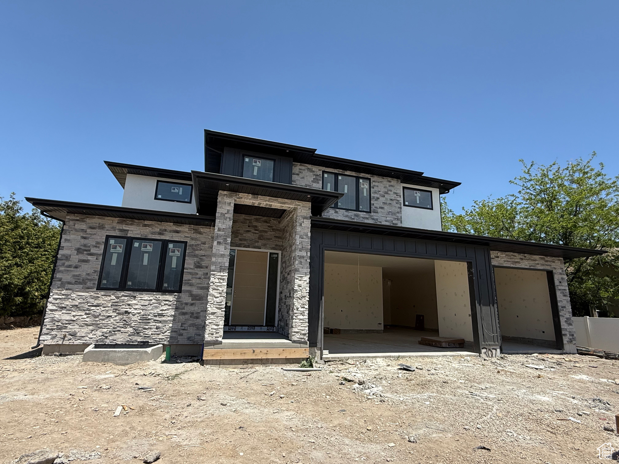 UNDER CONSTRUCTION | ESTIMATED COMPLETION: October 2025 Don't miss your opportunity to own this exceptional custom home in one of South Jordan's most desirable neighborhoods! Currently under construction and thoughtfully designed for both elegance and function, this spacious residence offers 7 bedrooms, 6 bathrooms, and a 4-car garage, making it the perfect sanctuary for modern living. This home features a private, tree-lined yard, creating a peaceful setting ideal for entertaining or relaxing. Inside, you'll find luxurious finishes and generously sized gathering areas with a seamless flow for hosting and everyday life. The open floor plan is highlighted by two main floor offices, perfect for working or learning from home. The deluxe accessory dwelling unit (ADU) is an incredible bonus, offering full functionality for multigenerational living or income potential, complete with its own separate access and stylish design. Additional highlights include: A dedicated exercise room, a rec room with a wet bar and theater space for ultimate entertainment, high-end finishes and custom details throughout, and mature trees providing privacy and natural beauty. This home has been expertly designed for both luxury and everyday convenience.